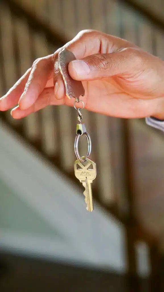 Mortgage Loans in Germany Close-up of a hand holding a key, symbolizing new homeownership or rental.